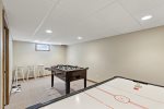 Enjoy Foosball and Air Hockey in the finished basement game room